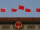 chinese flag flutters above the chinese national emblem at the great hall of the people in beijing china may 22 2020 photo reuters